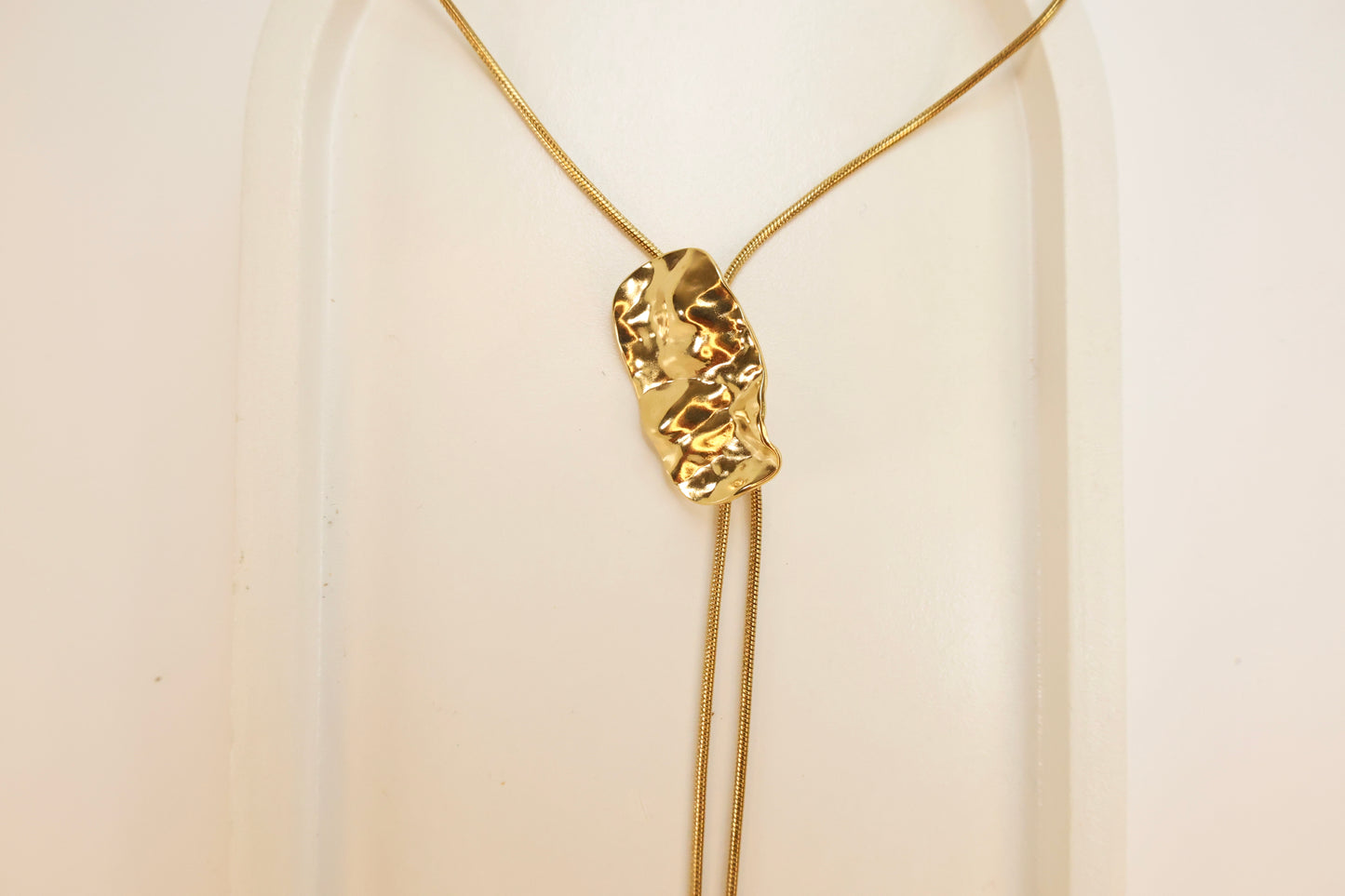 The Liquid Gold Lariat