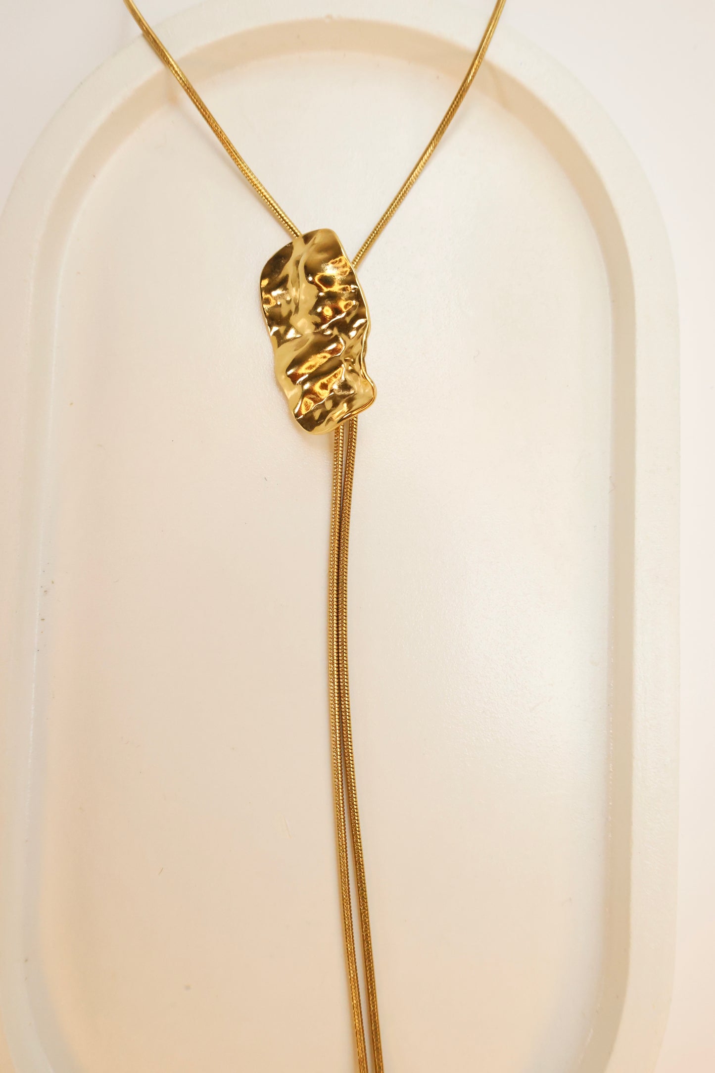 The Liquid Gold Lariat